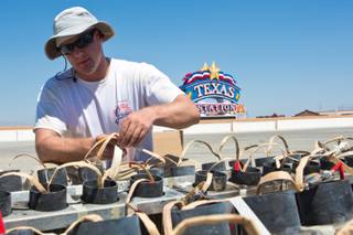 Chris Wasco, pyrotechnician for Grucci's of New York, is rigging shells for Texas Stations' July 4th fireworks show, Tuesday July 3, 2012.